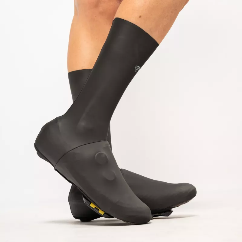 Side view of Spatzwear AquaSokz Long black oversocks, high-cut aerodynamic design for time trials.