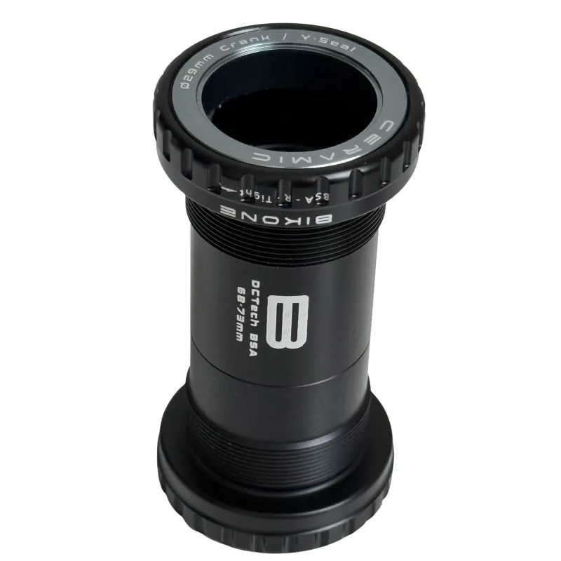 Boîtier Bikone BSA DUB céramique en position verticale — filetage BSA 68-73 mm, roulements céramiques haute performance.