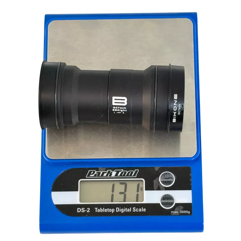 Bikone BBright 79 mm Shimano 24 mm bottom bracket on scale, 131 g weight.