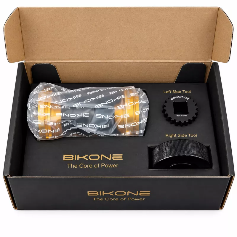 Coffret ouvert du boîtier de pédalier Bikone avec boîtier, emballage de protection et outils de montage inclus