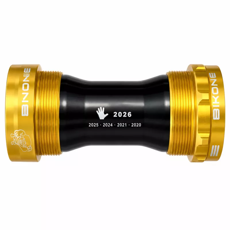 Vue arrière du boîtier de pédalier Bikone BSA 24 mm noir et doré avec marquage édition 2026